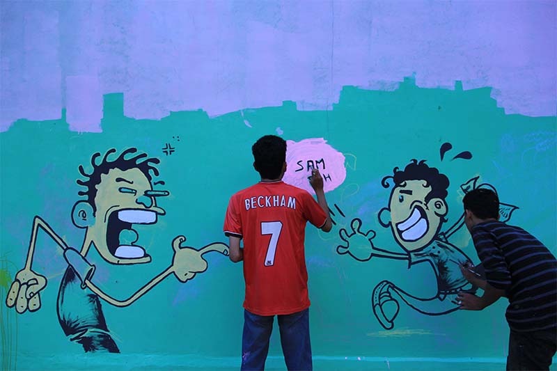 Warga membuat graffiti di tembok acara Festival Kota Kita di Banda Aceh (Foto M Iqbal/SeputarAceh.com)